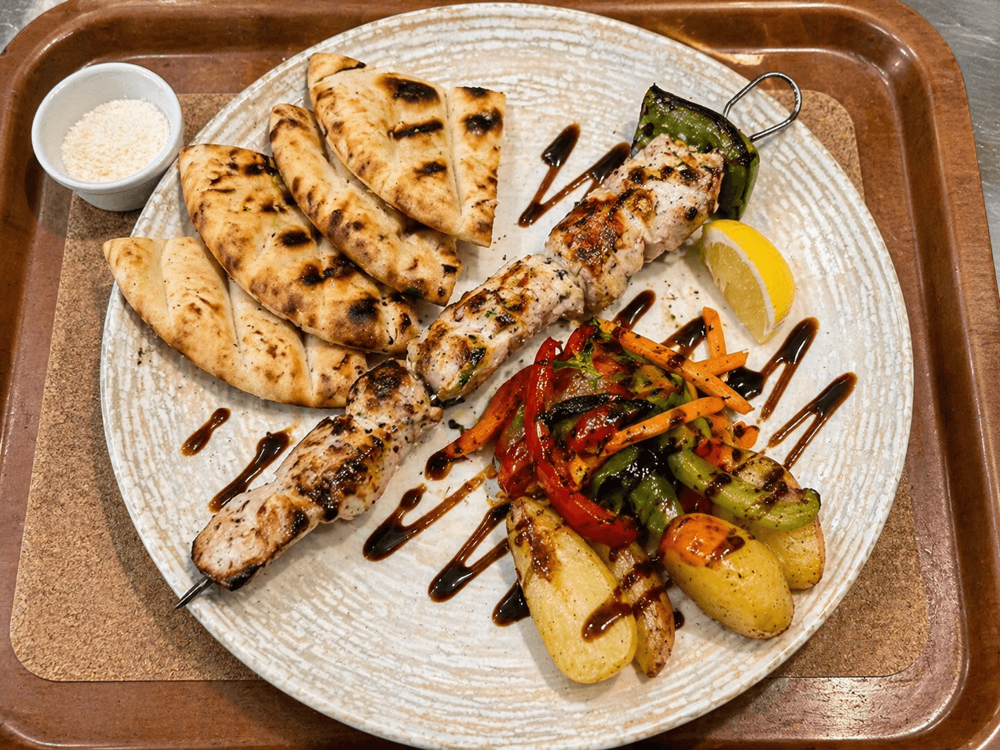 Orama mixed grill platter with souvlaki, pita, peppers and roasted potatoes